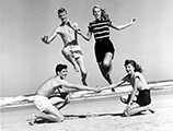 Young adults jumping at Daytona Beach (1948)