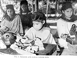 Seminole girls making costume dolls (1930s)