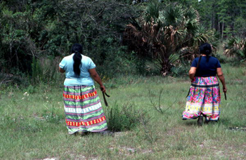 Mary B. Billie and daughter Claudia C. John in search of palmetto fibers to make dolls: Big Cypress Seminole Indian Reservation, Florida 