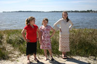 Three Girls in Front of Marsh Grass Now