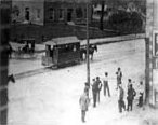 Horse-drawn trolley passing in front of the Marion County courthouse