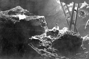 Walter Holmes looking up towards entrance of Saber-Tooth Cave from deeper part of cave : Lecanto, Florida