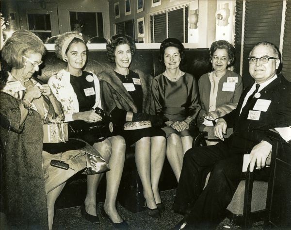 First Lady Lady Bird Johnson with others aboard the campaign train.