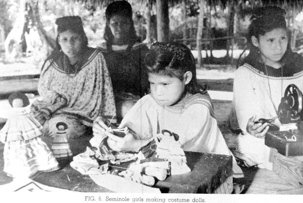 Seminole girls making costume dolls (ca. 1930s)