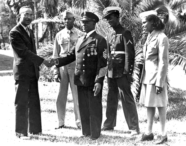 President James A. Colston of Bethune-Cookman College with WWII vet and students.