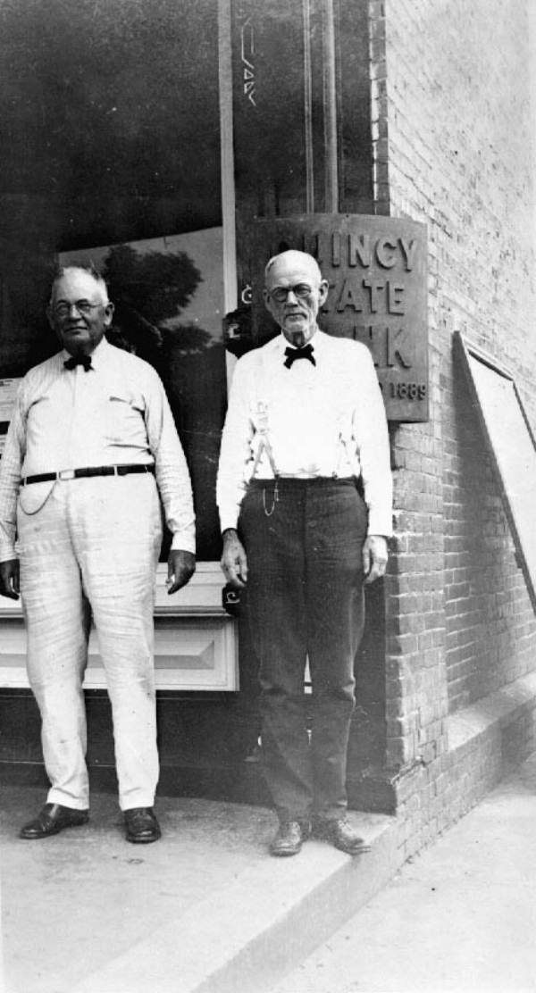 The original Coca-Cola millionaire, Pat Munroe (right) with local shade tobacco producer and businessman, E.B. Shelfer, Sr. outside of the Quincy State Bank, ca. 1920.