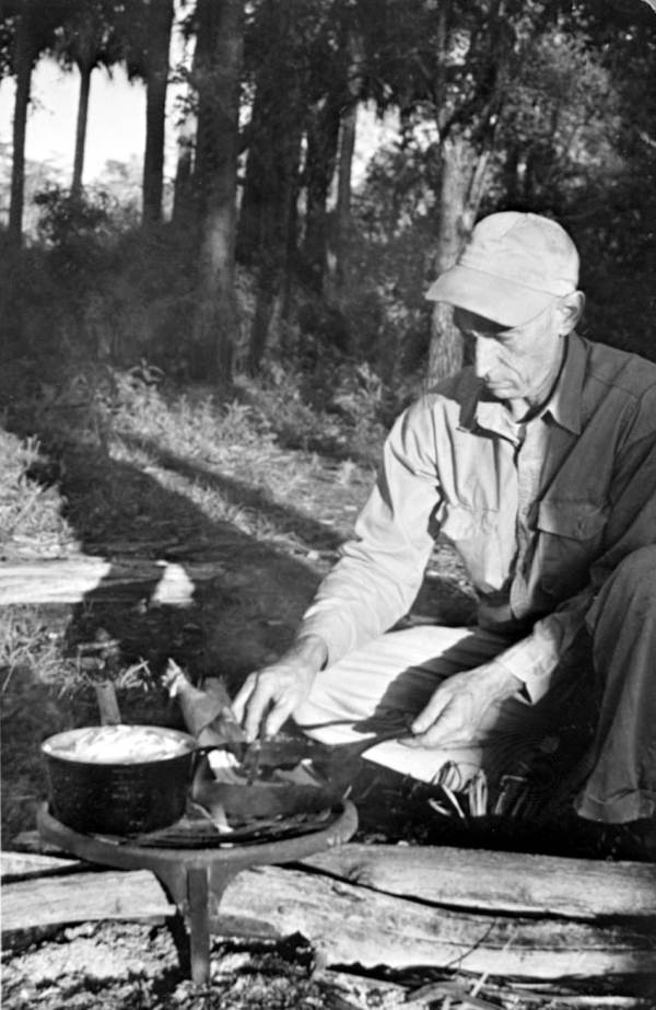 Everglades guide George L. Espenlaub prepares a pot of swamp cabbage (photo circa 1950s).