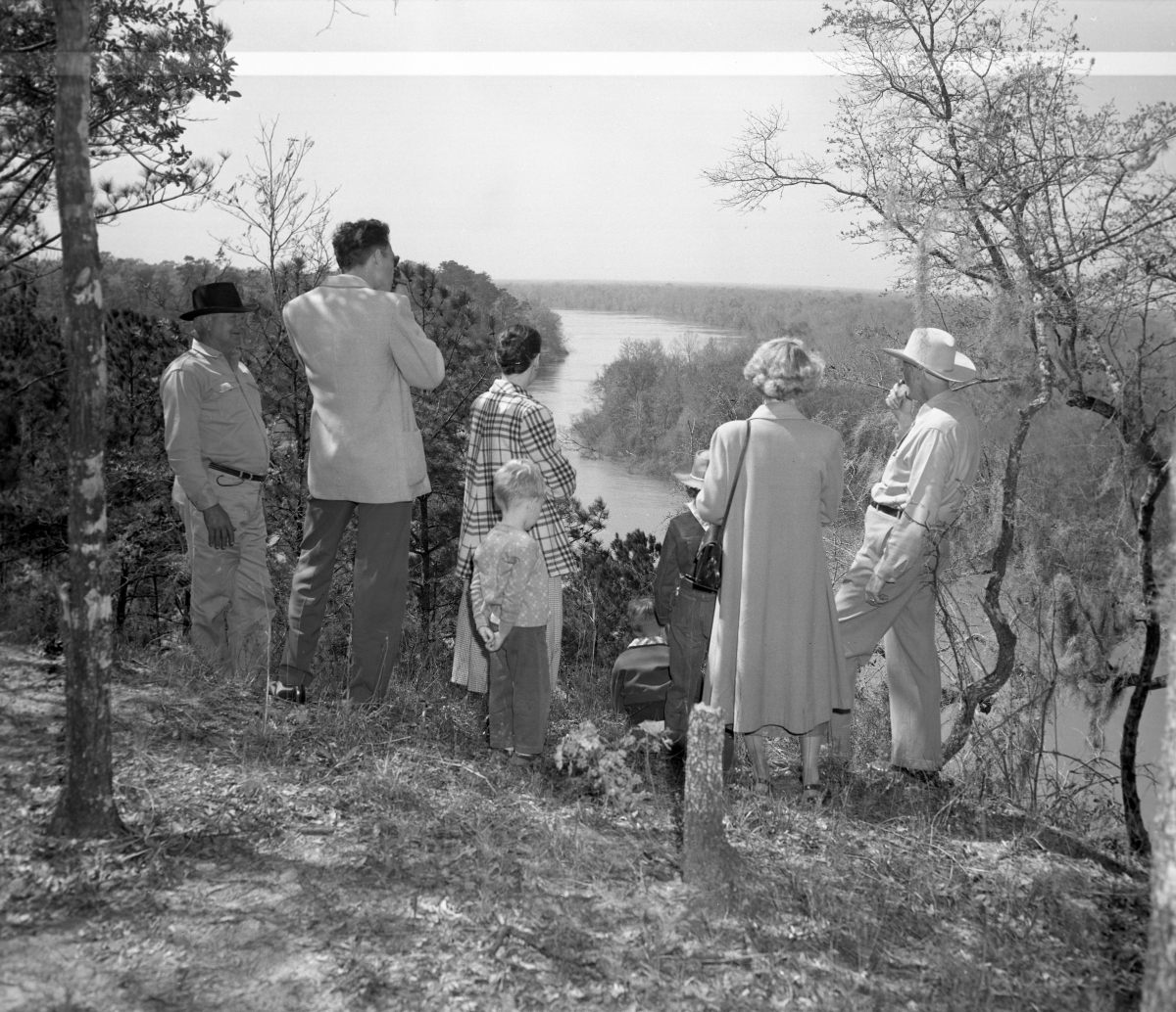 Family looking at the Apalachicola River from a bluff in the garden of eden photo by=