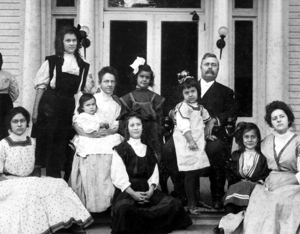 Governor Broward with his family on the steps of Florida's newly-built Governor's Mansion in Tallahassee. The Browards were the first family to occupy the new building. Elizabeth Broward, who is shown seated on her mother's lap, was the first child ever born to an incumbent governor of Florida.