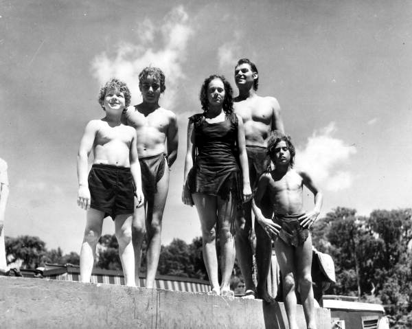 Members of the cast at Wakulla Springs (1941). L to R: Johnny Sheffield, a stand-in for Sheffield, Jean Knapp (a stand-in for Maureen O'Sullivan), Johnny Weissmuller, and another Sheffield stand-in.