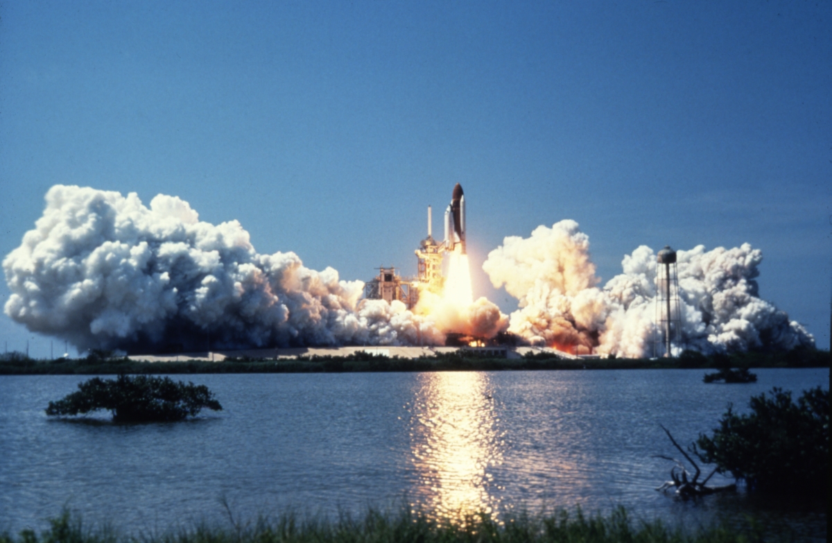 The space shuttle lifts off from Kennedy Space Center on Merritt Island (circa 1980s).