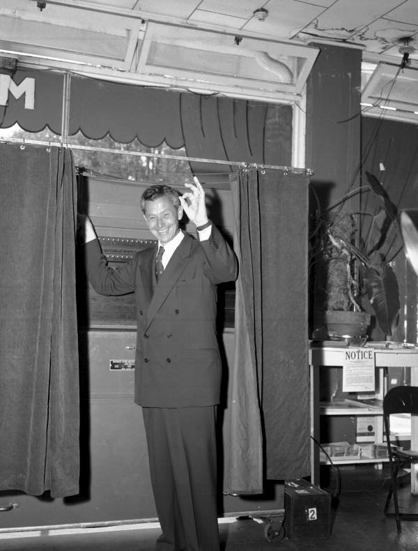 Senator LeRoy Collins leaving the voting booth.