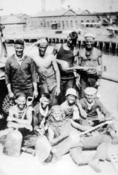 Group portrait of the "Black Gang" aboard the USS Massachusetts battleship.