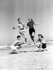 Young adults jumping at Daytona Beach