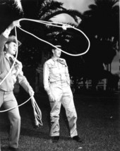 Directors of cowboy week, Hal Davis, left, and Donald Kay, right, practice up on rope tricks - Ocala, Florida