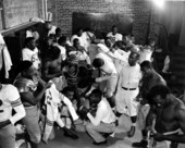 Coach Jake Gaither in the locker room with his FAMU football team - Tallahassee, Florida.