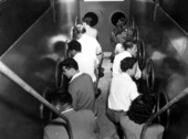 Visitors look out the windows of the submarine boat - Dunnellon, Florida