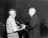 Two men play the violin during the Florida Folk Festival - White Springs, Florida