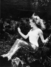 Mermaid at Weeki Wachee Springs viewing herself in a mirror