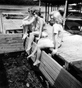 Three women sit above the crab bin at Ocala National Forest - Salt Springs, Florida