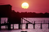 Sunset at the "Thomas guest house" on stilts in Cedar Key, Florida.