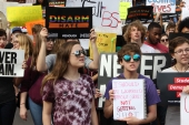 Close-up view showing student demonstrators with their signs during the Never Again Rally in Tallahassee.