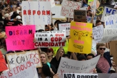 Close-up view showing signs being held up by student demonstrators at the Never Again Rally in Tallahassee.