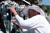 Carolyn Gorton Fuller working on her "bottle wall fence" - Key West, Florida.