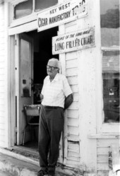 Rex Shaw standing in front of his factory on Fleming Street - Key West, Florida.