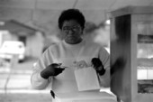 Jamaican American woman from Patties and Ting packing Jamaican beef patties at Zora Neale Hurston Festival- Eatonville, Florida