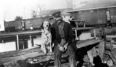 Captain Will Newman sitting on the dock with dog and cat - Palatka, Florida.