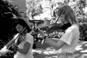 Apprentices Pam Carsey and Linda Gesele learning to play the Irish fiddle from James Kelly - Miami, Florida.