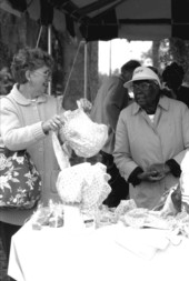 Jimmie Lee Harrell (R) selling hats at the Zora Neale Hurston Festival- Eatonville, Florida