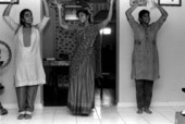 Nila Radhakrishnan (center) teaching apprentices Prema Menon and Priya Menon East Indian dance- Dade City, Florida