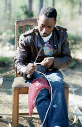 Alphonso Jennings cutting white oak into strips in order to make baskets - Lamont, Florida