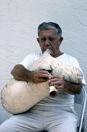 Greek bagpipe player Nikitas Tsimouris playing the tsabouna - Tarpon Springs, Florida