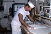 Baker Howard Goren adding flour to pastry dough - Miami Beach, Florida