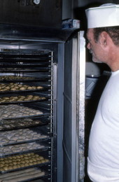 Baker Howard Goren showing baked goods in freezer - Miami Beach, Florida.