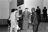 Bess Hawes walking down steps after receiving plaque and key awards during Triumphant Gospel Singers Association quartet reunion concert at Masonic lodge - Jacksonville, Florida.