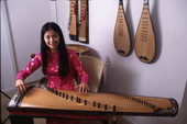 Tina Nguyen, Vietnamese musician with a Dan Bau - Orlando, Florida.