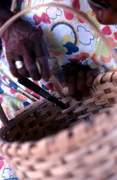 Close-up of Lucreaty Clark finishing her white oak basket