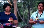 Mary Billie and her daughter Claudia C. John holding handmade Seminole dolls - Big Cypress Reservation, Florida