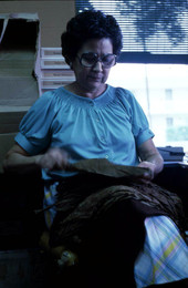 Mrs. Rafael Martinez sorting tobacco leaves for cigars - Miami, Florida.