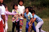 Seminole children playing stick ball - Big Cypress Reservation, Florida