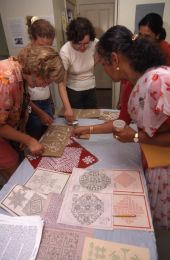 Jaya Radhakrishnan leading a workshop in Indian rangoli, or sandpainting, at the 1998 Florida Folk Festival.