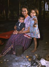 Portrait of a Seminole mother with her children at the Brighton Indian Reservation.