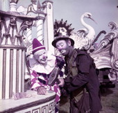 Ringling Circus clowns Charlie Bell, left, and Emmett Kelly cracking a peanut with a sledgehammer in Sarasota, Florida.