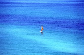 Distant view of a windsurfer in the Gulf of Mexico off the coast of Panama City Beach.