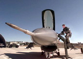 Pilot climbing into an F16 jet fighter airplane at Eglin Air Force Base