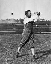 Race car driver Sig Haugdahl with clubs he had specially made